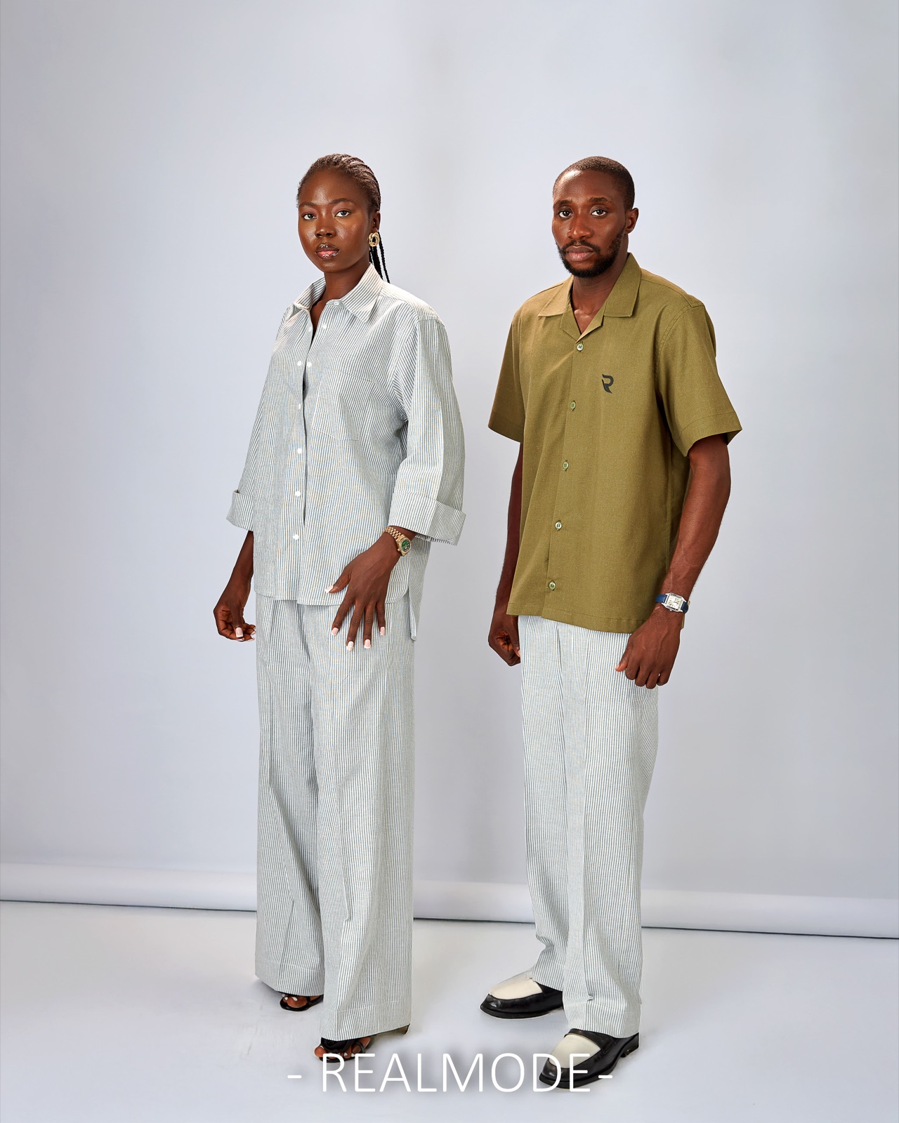 Two models in Realmode co-ord sets against a studio backdrop